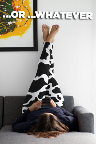 surfing on a phone with cow leggings